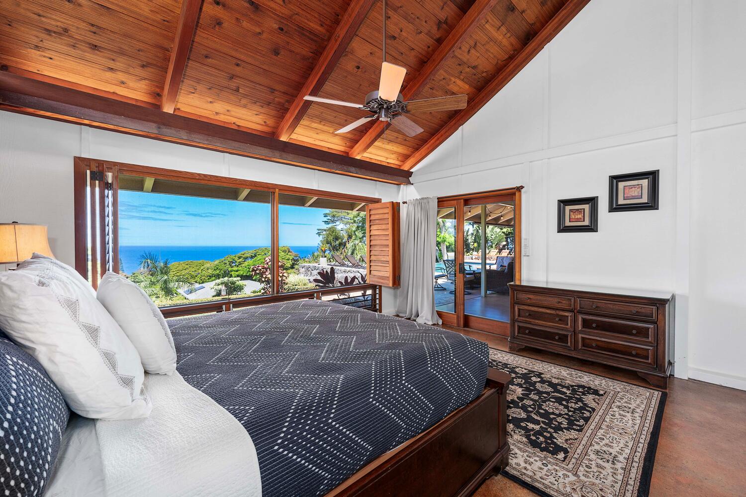 Kailua-Kona Vacation Rentals, Hale Joli - Tranquil primary bedroom with large windows, private lanai access and tropical views.