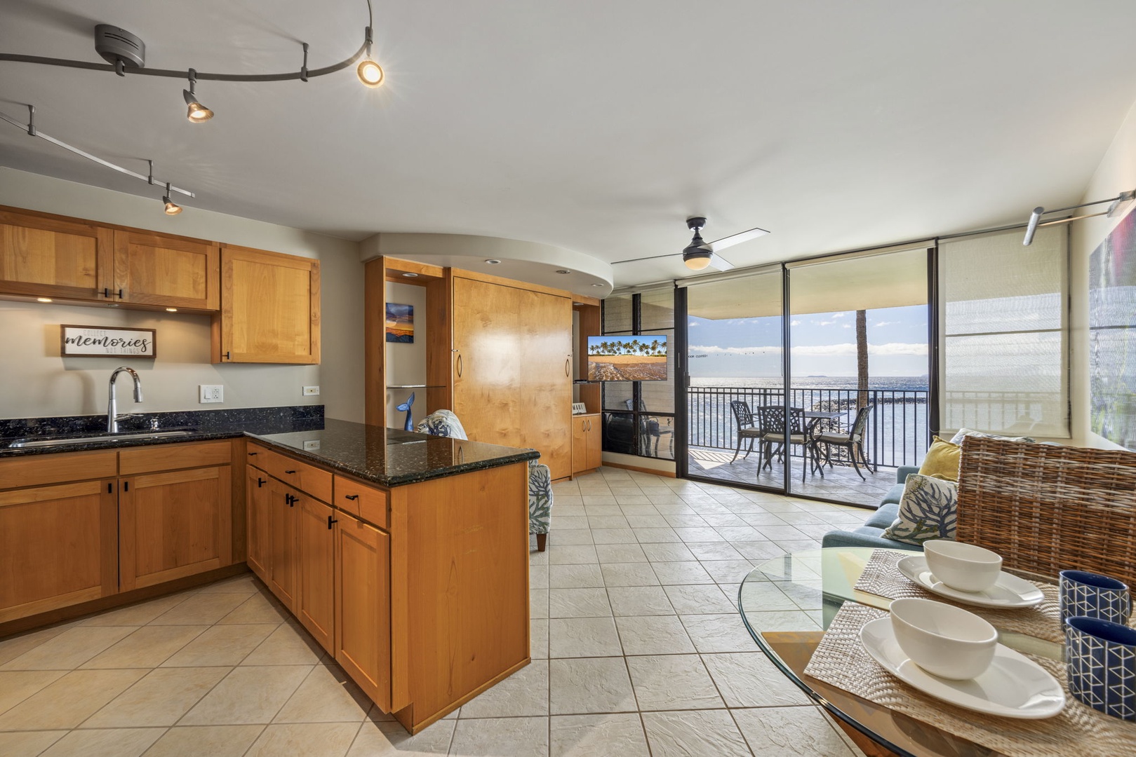 Wailuku Vacation Rentals, Milowai 310 - Find the glassware behind the cabinet's doors, then claim the two-top table just past the counter.