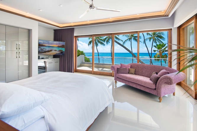 Honolulu Vacation Rentals, Diamond Head Beachfront Estate - Primary suite with panoramic ocean views and seating area—your private retreat by the sea.