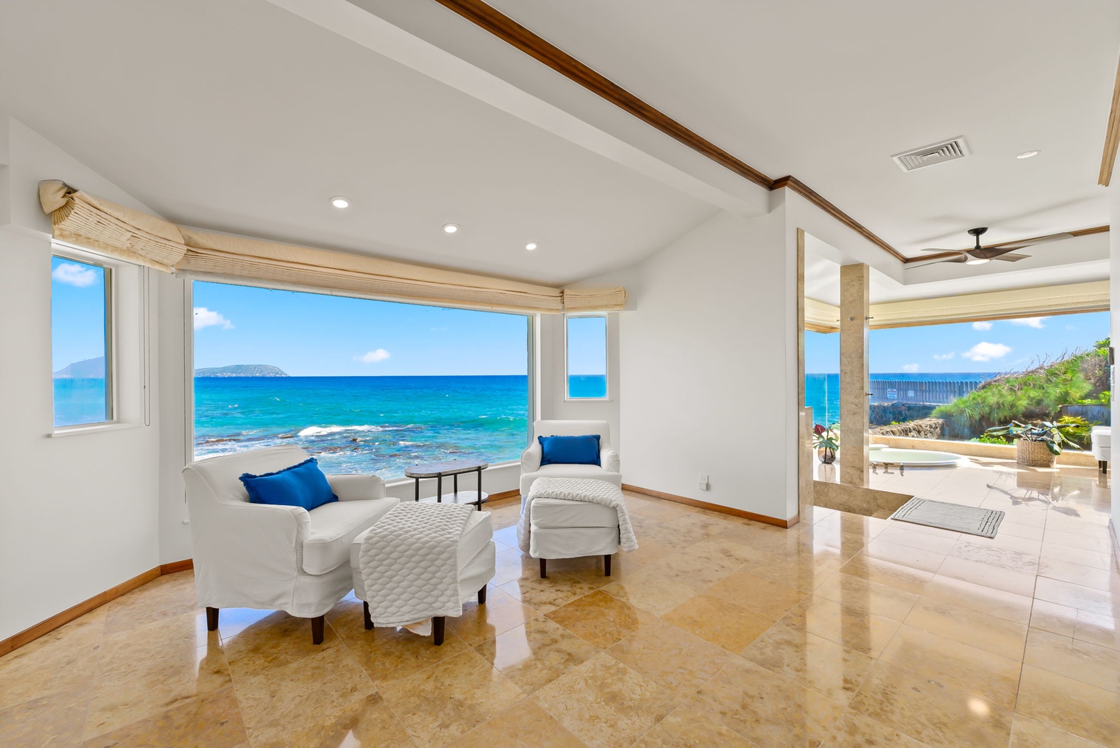 Honolulu Vacation Rentals, Black Point Ocean Villa - Endless ocean views from your elegant living space, where turquoise waters stretch to the horizon beyond floor-to-ceiling windows.
