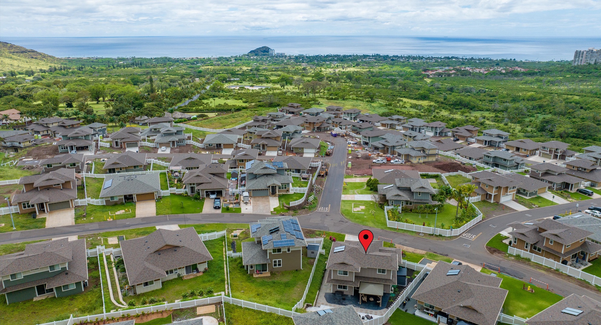 Makaha Valley Vacation Rentals, Makaha Valley Hale Kai** - Drone shot of the neighborhood with the ocean visible in the distance.