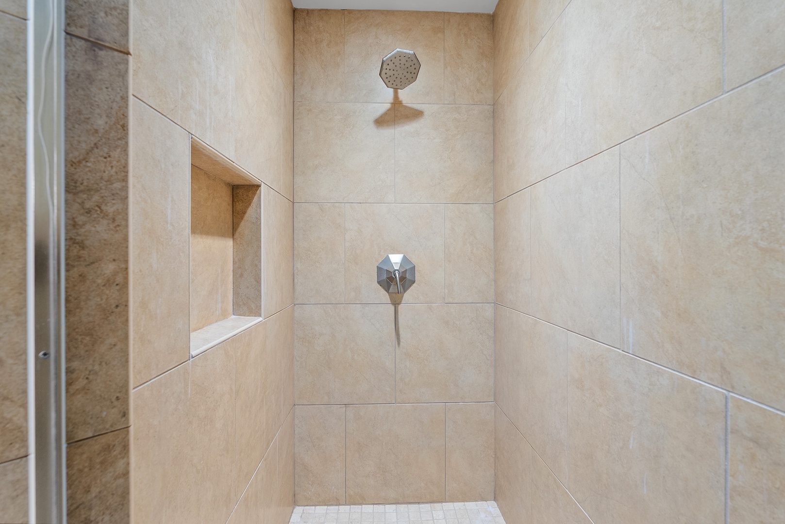 A tiled niche keeps the shampoo in reach through a refreshing shower.
