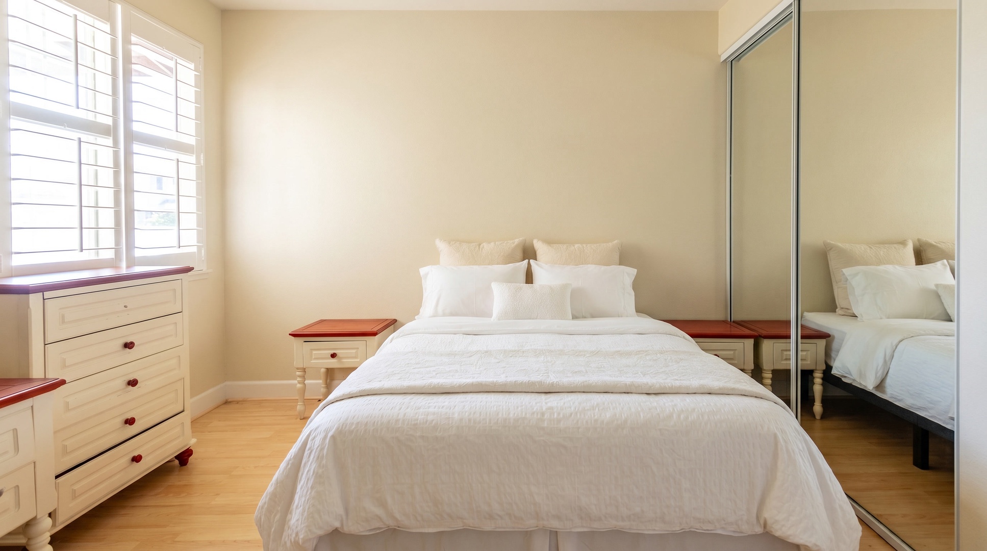 Draw the plantation shutters open and this guest bedroom fills with daylight.