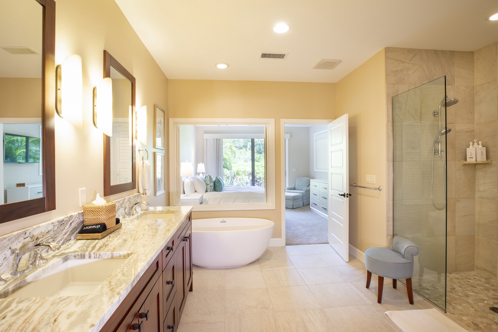 Kamuela Vacation Rentals, Mauna Lani KaMilo #503 - Indulge in spa-inspired bliss in the primary bathroom, complete with soaking tub, dual vanities, and walk-in shower.