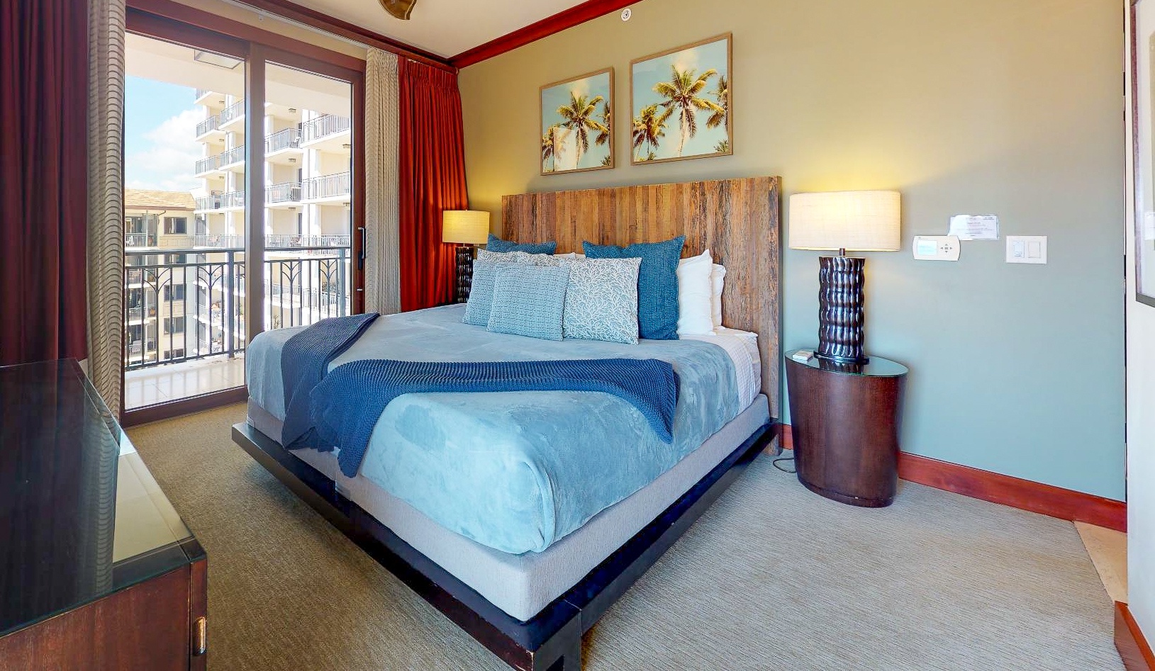 Kapolei Vacation Rentals, Ko Olina Beach Villas O1121 - The primary guest bedroom with access to the lanai.