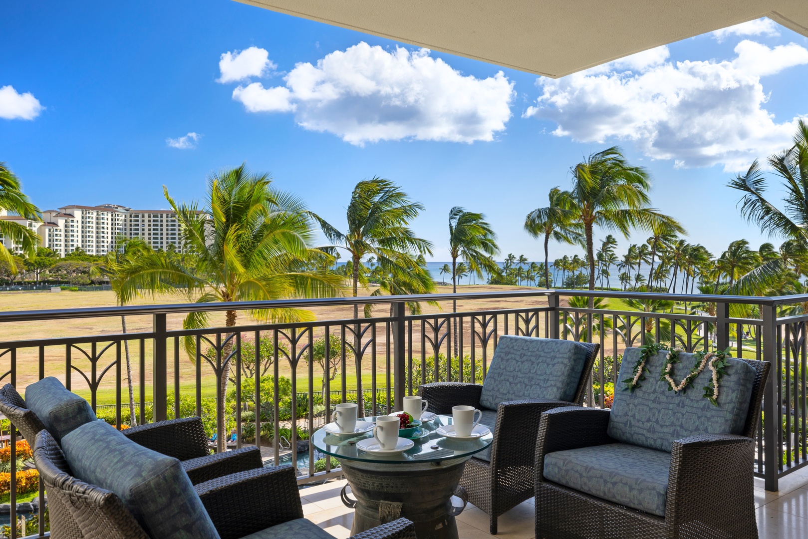 Kapolei Vacation Rentals, Ko Olina Beach Villas B403 - Sip your morning coffee from this stunning balcony overlooking swaying palms and pristine coastline.