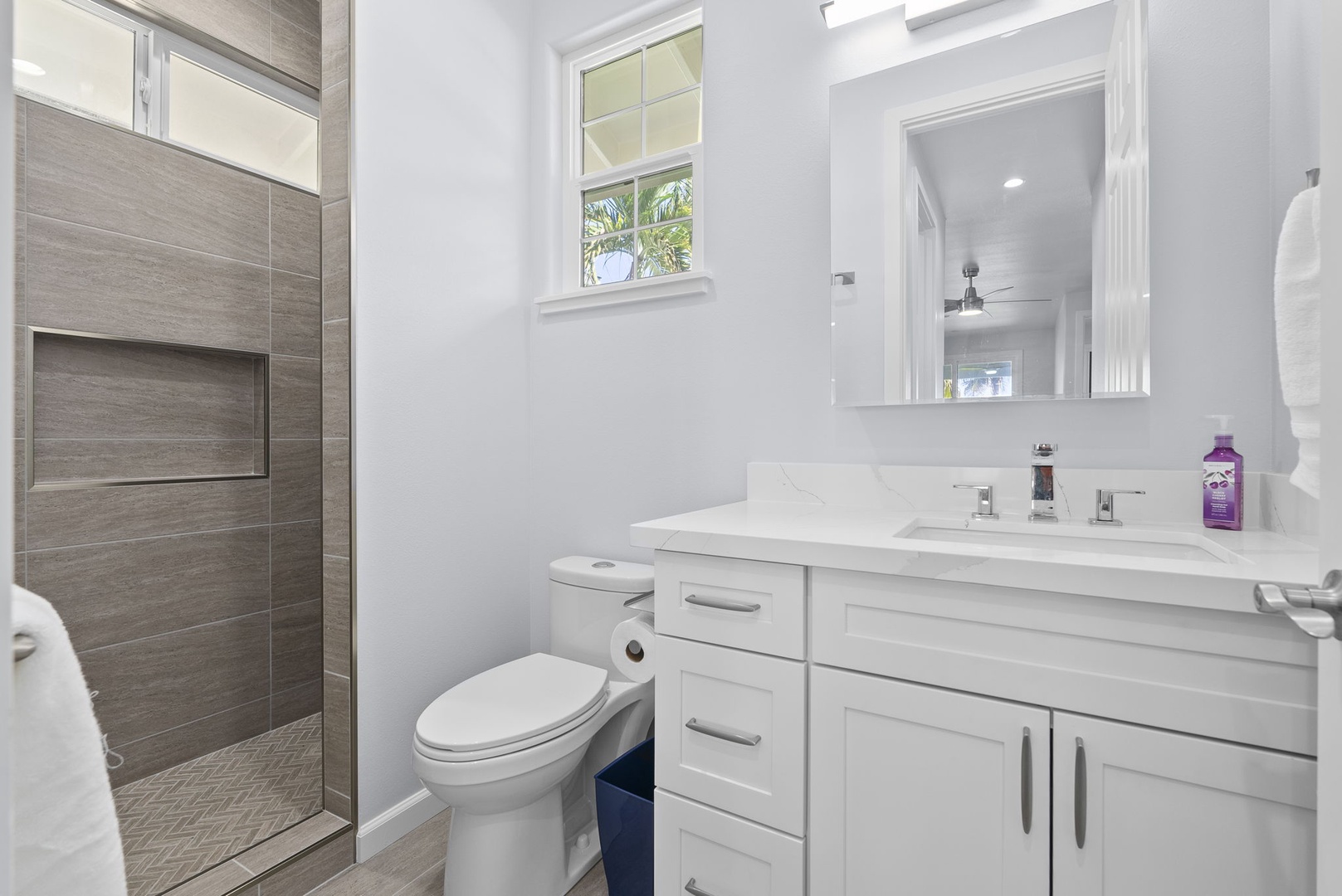 Waianae Vacation Rentals, Oceanfront Luxury Dream Estate - Full bath with walk-in shower, stone tile walls, and spacious vanity—just steps from guest areas.