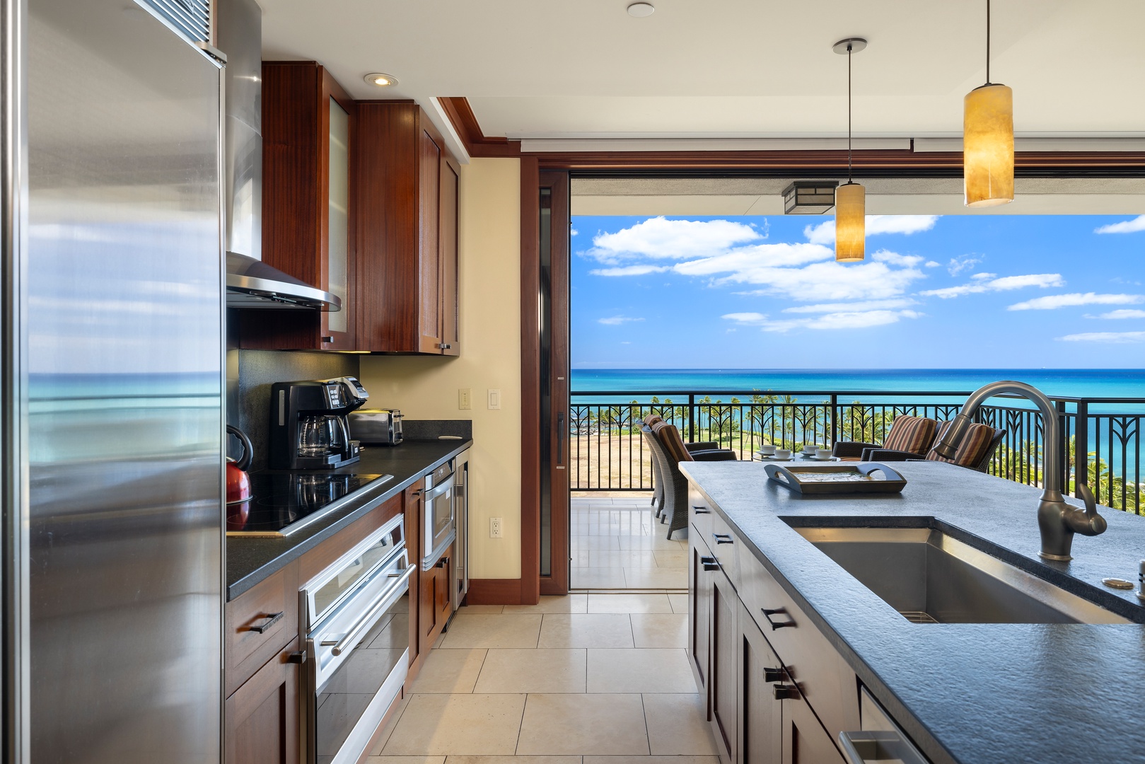 Kapolei Vacation Rentals, Ko Olina Beach Villas B901 - Your gourmet kitchen opens to breathtaking ocean views, where cooking becomes pure joy with azure waters stretching endlessly beyond your private balcony.