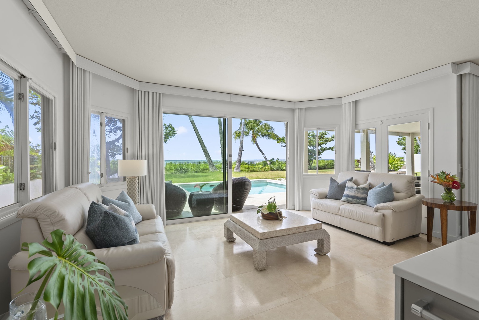 Honolulu Vacation Rentals, Paradise Beach Estate - Step into a sun-drenched sitting room with wraparound windows—where every seat is front row to paradise.