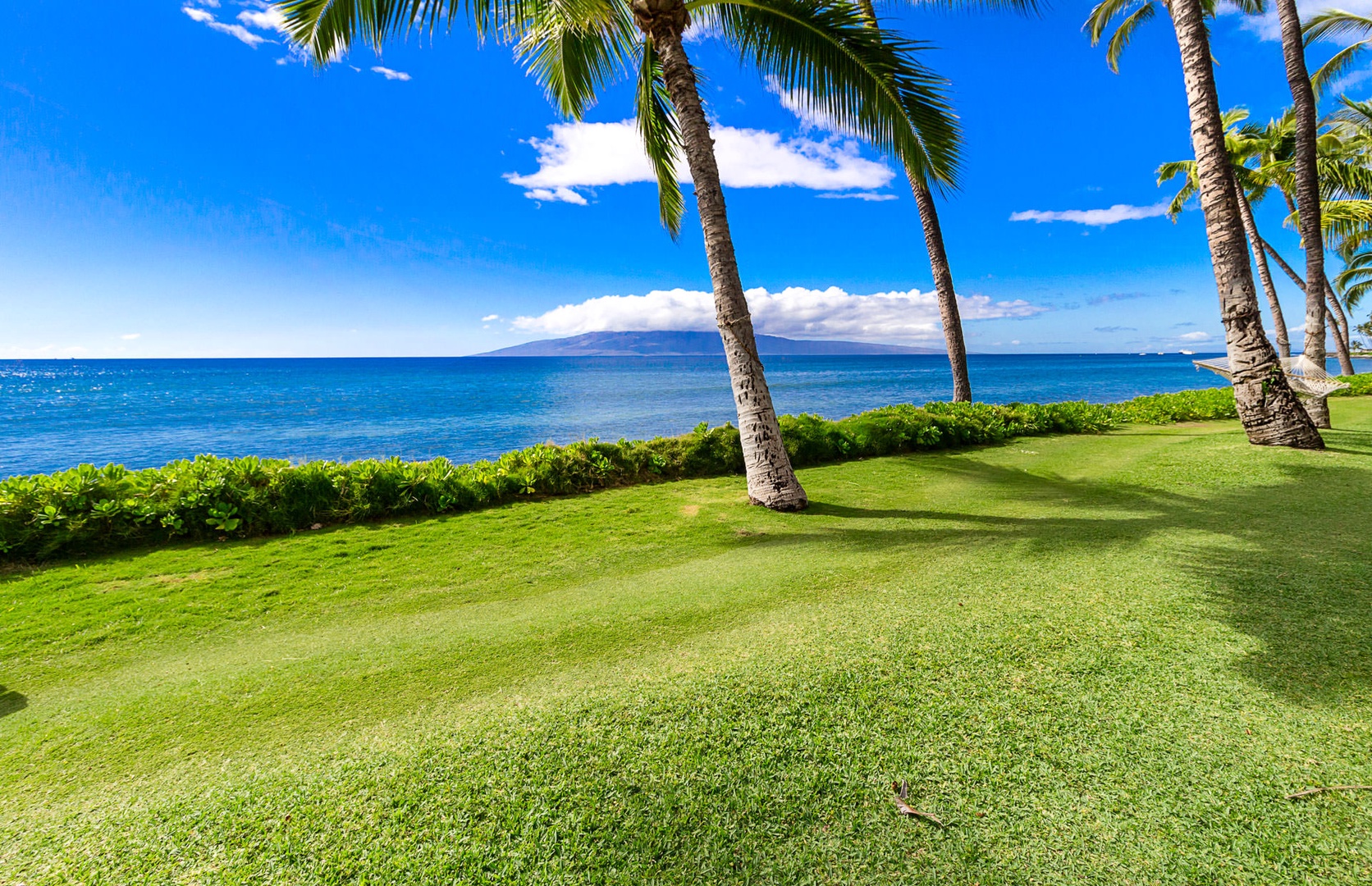 Lahaina Vacation Rentals, Puamana 240-3 - Indulge in luxurious relaxation on your private lanai, steps from the beach.