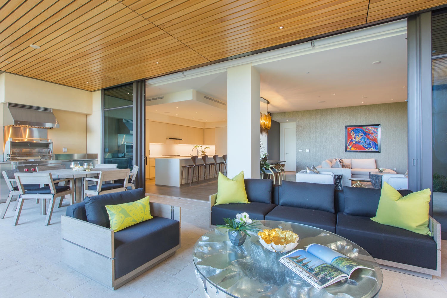 Honolulu Vacation Rentals, Park Lane Sunset Resort - Sink into sleek modern comfort where your lanai flows seamlessly from lounge to gourmet kitchen, all under soaring wood ceilings.