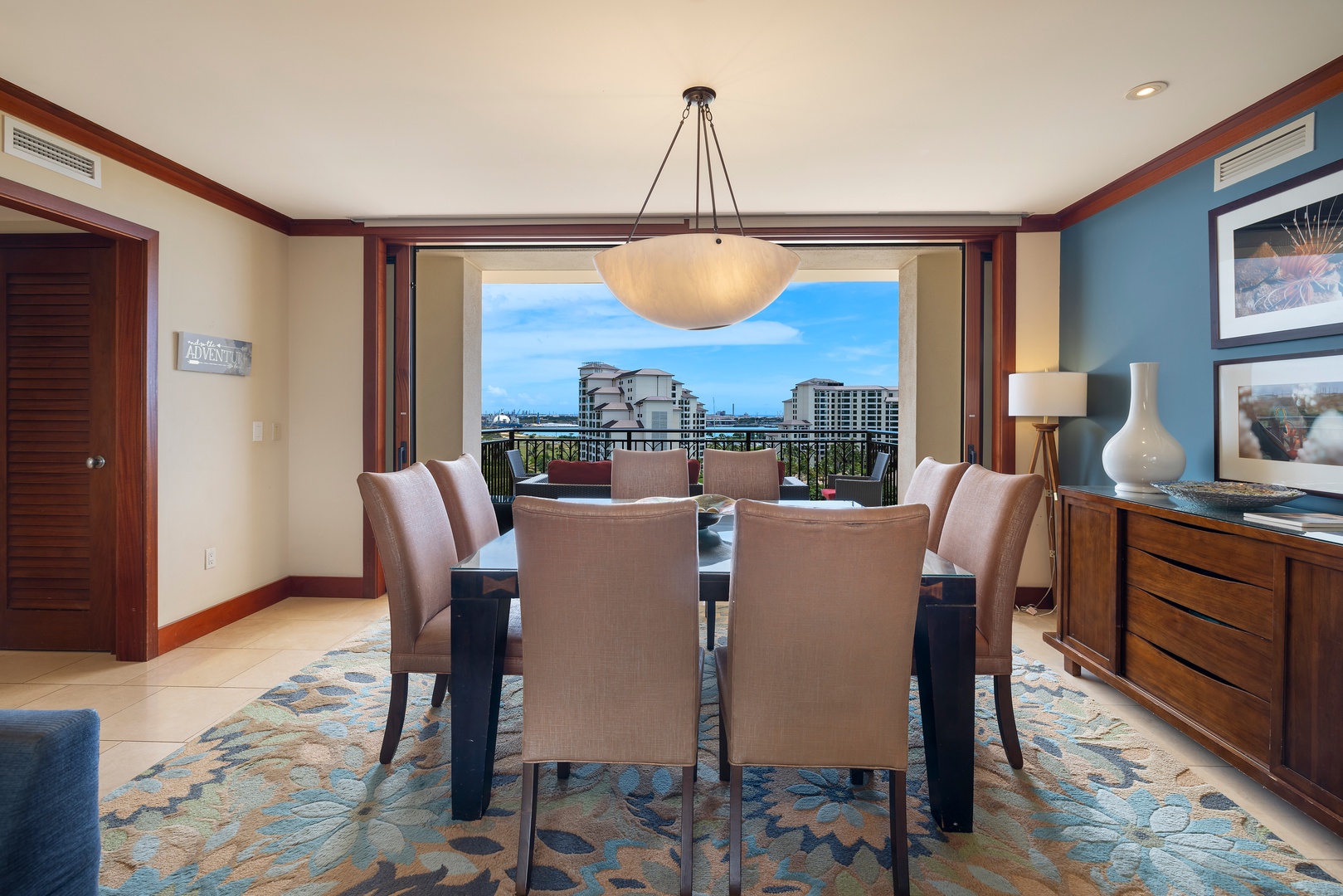 Your elegant dining space frames city views through floor-to-ceiling windows, creating the perfect backdrop for memorable meals together.