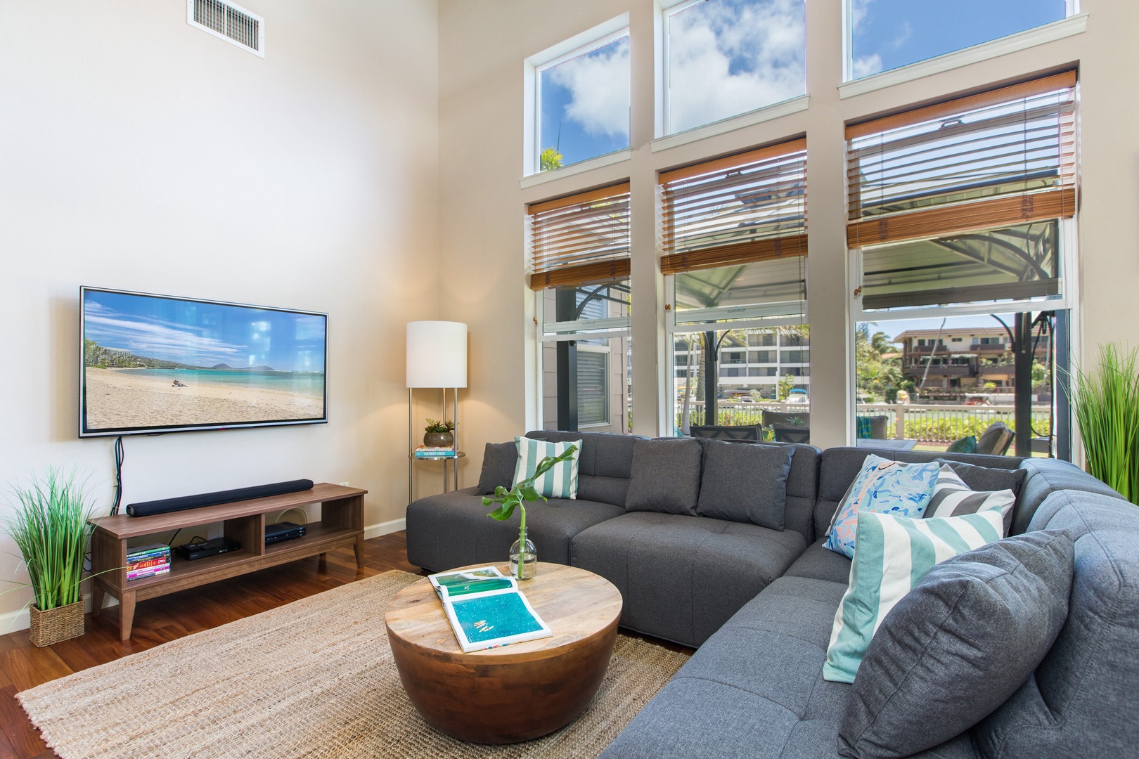 Honolulu Vacation Rentals, Ohana Kai - Unwind in comfort at Ohana Kai with its spacious couch, elegant wood flooring, refreshing air conditioning, and seamless wireless connectivity.