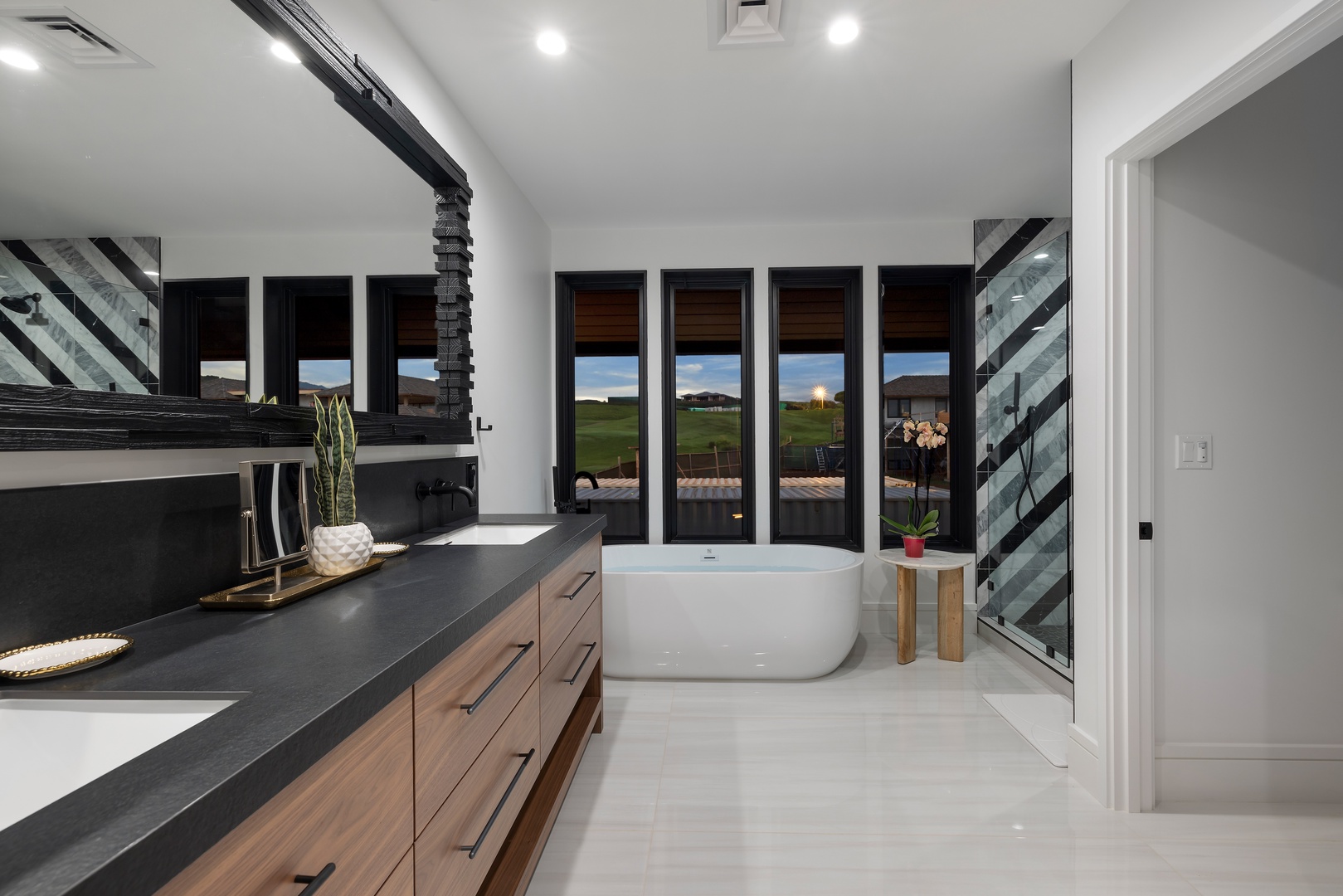 Koloa Vacation Rentals, Hale o ka Nene - Enjoy the sleek modern bathroom featuring freestanding tub and sunset views, perfect for unwinding.