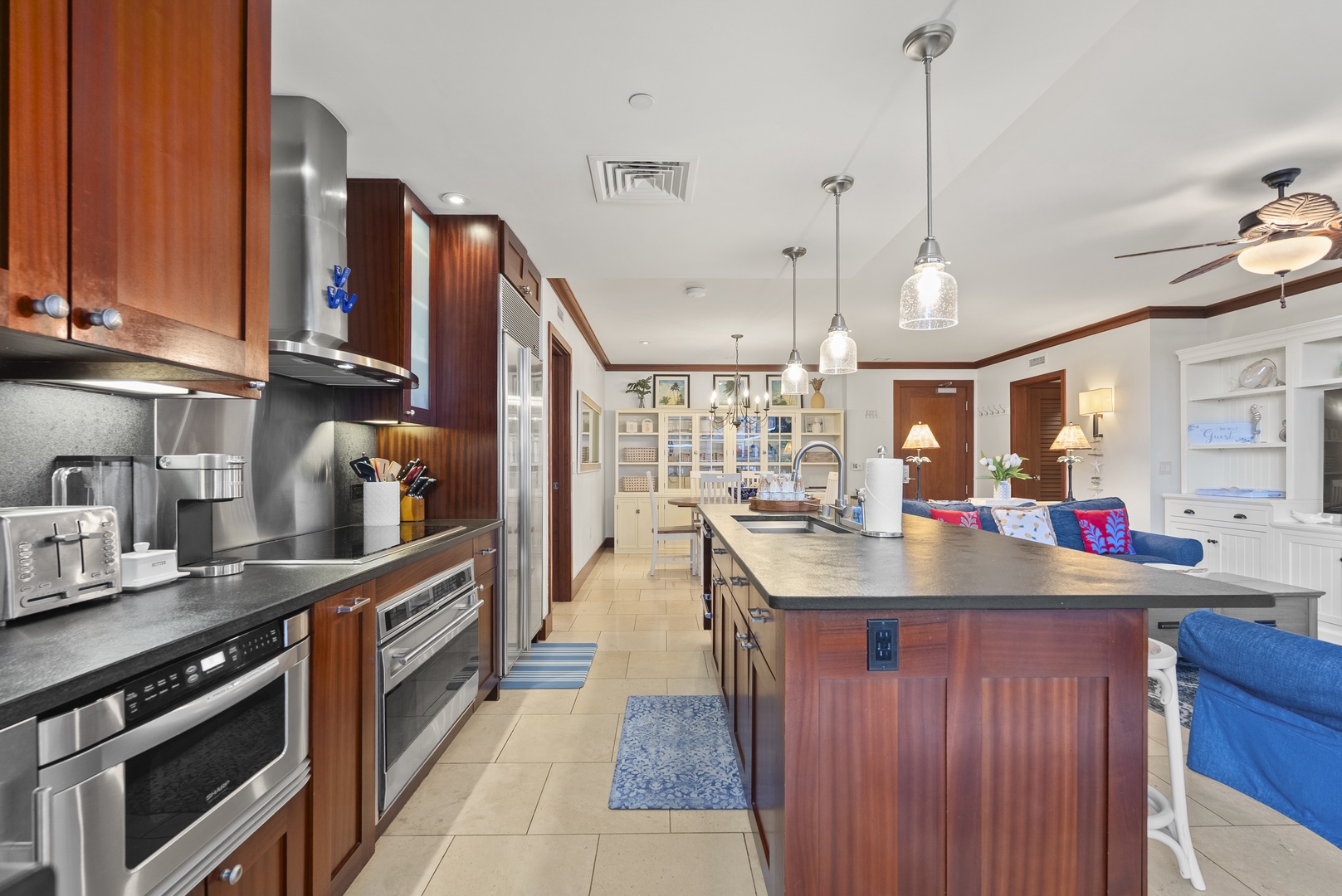 Kapolei Vacation Rentals, Ko Olina Beach Villas O211 - Cook under the pendant lights with bar seating an arm's length across the island.