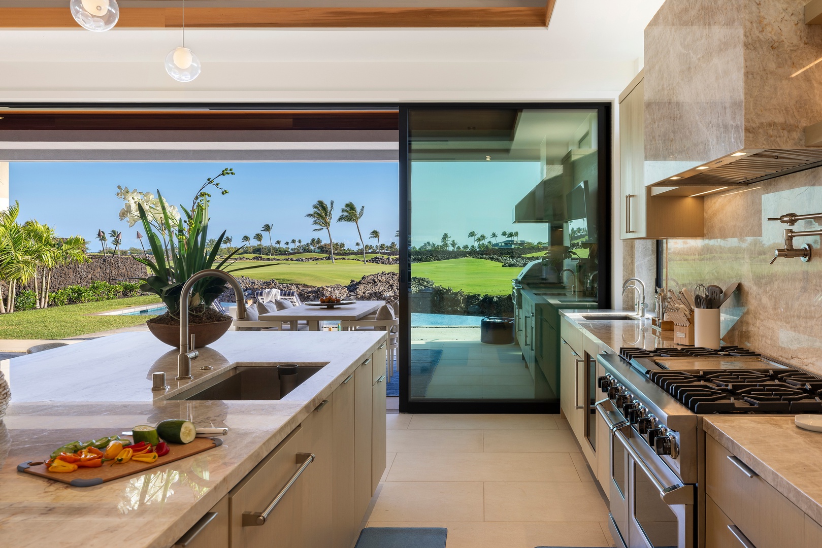 Kamuela Vacation Rentals, 6BD Mauna Lani Lux Golf Estate (6) at One Ocean - Prepare meals with the fairway just beyond the glass, bringing the beauty of the outdoors into every moment.