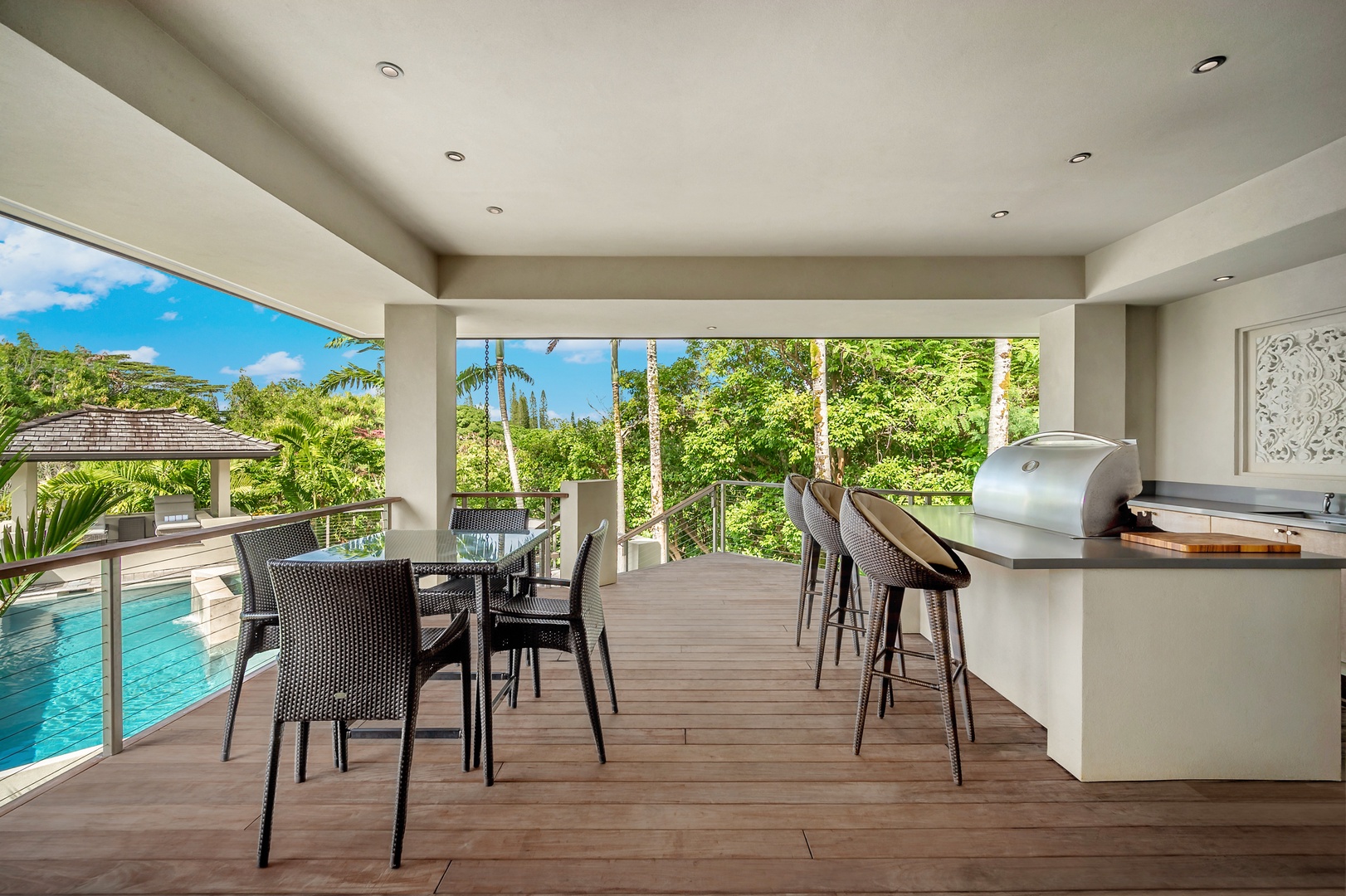 Princeville Vacation Rentals, Hanalei Plantation Villa - Outdoor dining area with ample seating, ideal for enjoying meals surrounded by nature.