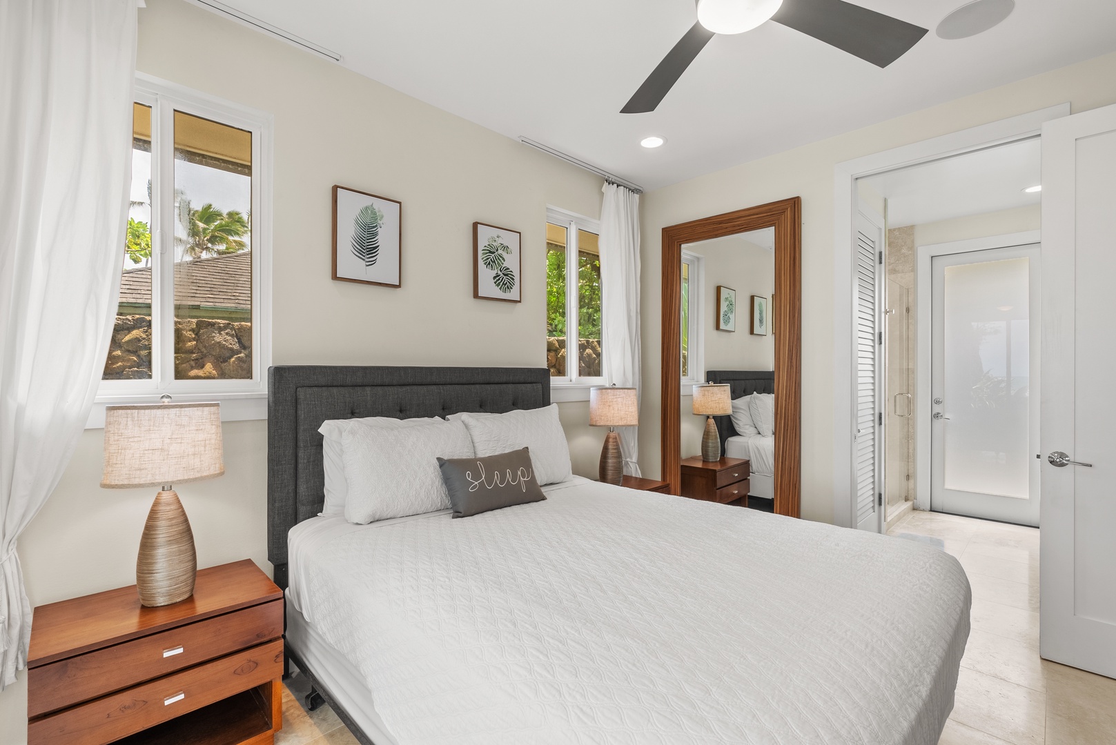Laie Vacation Rentals, Laie Beachfront Estate - The lower-level bedroom has ensuite bathroom, split AC & ceiling fan.