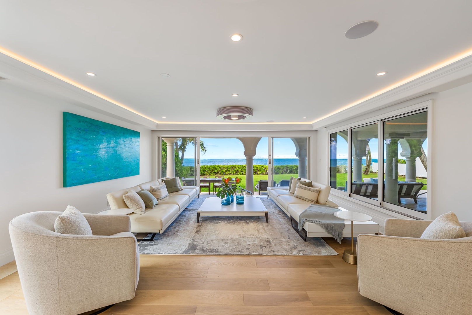 Kailua Vacation Rentals, Lanikai Sunrise Estate - Expansive living room with panoramic ocean views, perfect for gathering, lounging, or entertaining in style.