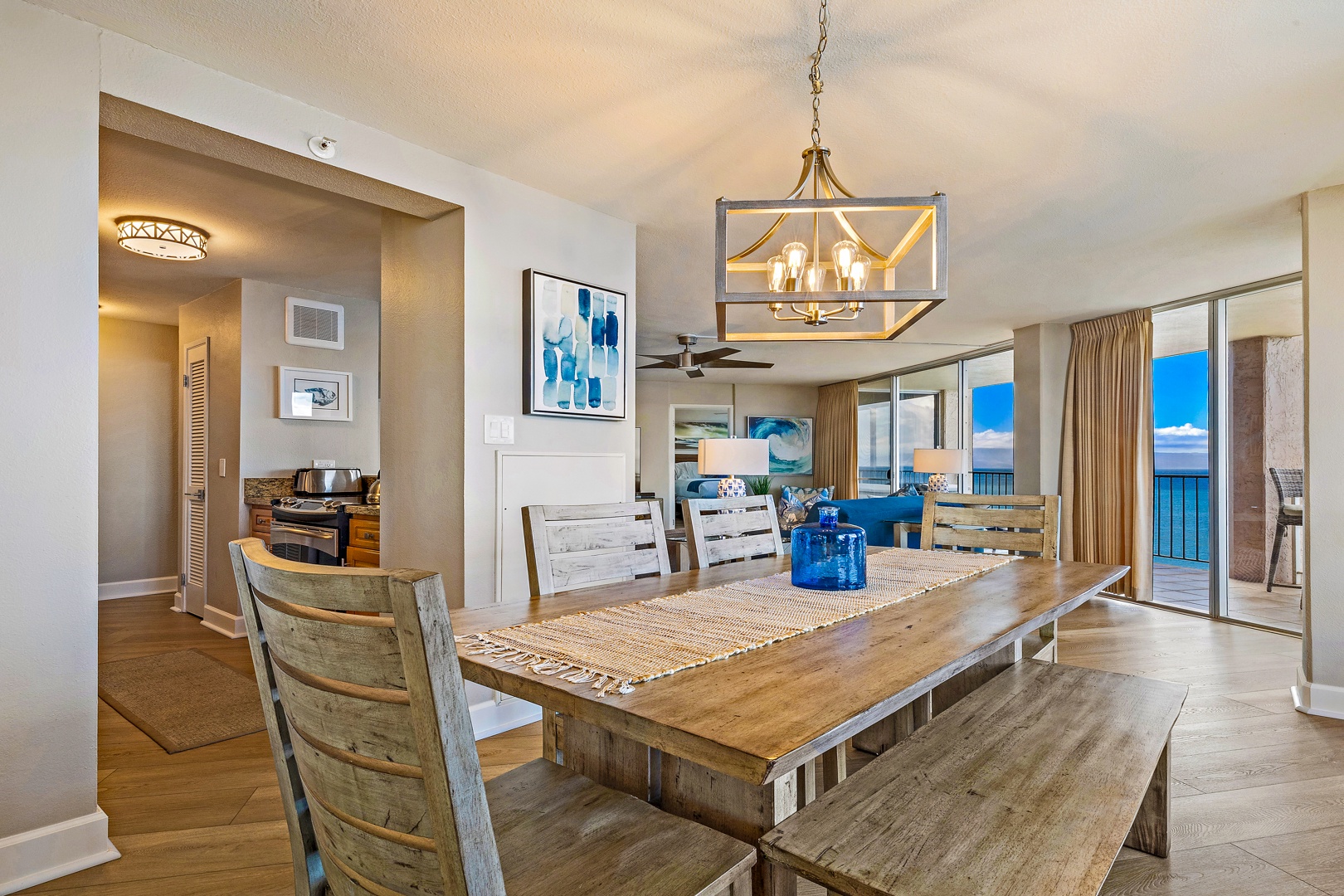 Lahaina Vacation Rentals, Royal Kahana 1010 - The dining area features a spacious wooden table, perfect for enjoying meals together in a warm and inviting atmosphere.