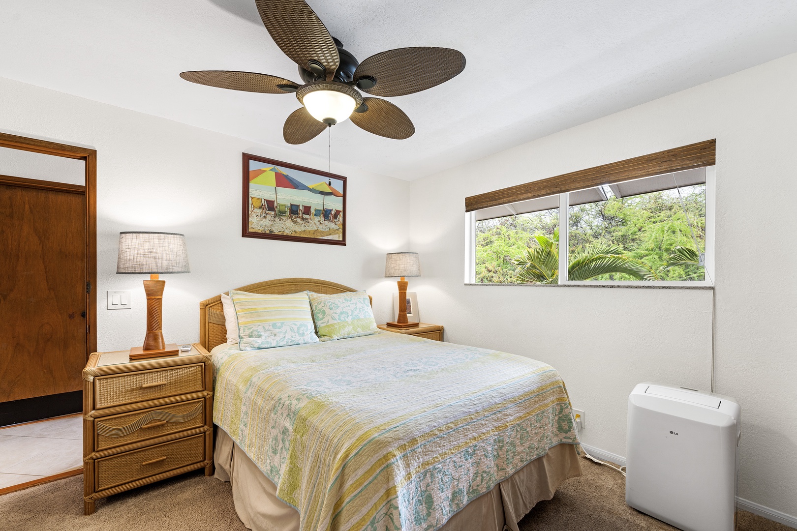 Kailua Kona Vacation Rentals, Kahalu'u Reef 203 - Primary bedroom equipped with portable A/C and Queen sized bed
