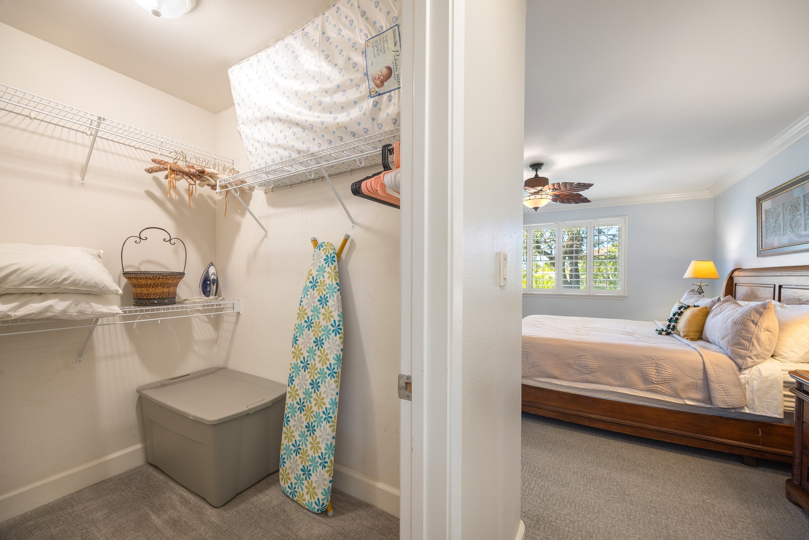 Your bedroom features a spacious walk-in closet with organized shelving and ample storage for all your belongings during your stay.