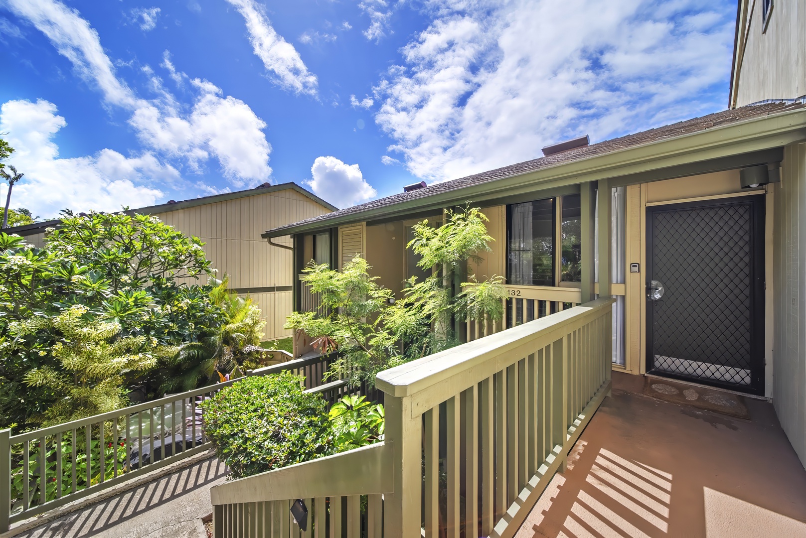 Kahuku Vacation Rentals, Kuilima Estates West #132 - Tropical greenery frames the entry, a quiet welcome at the end of the coast road.