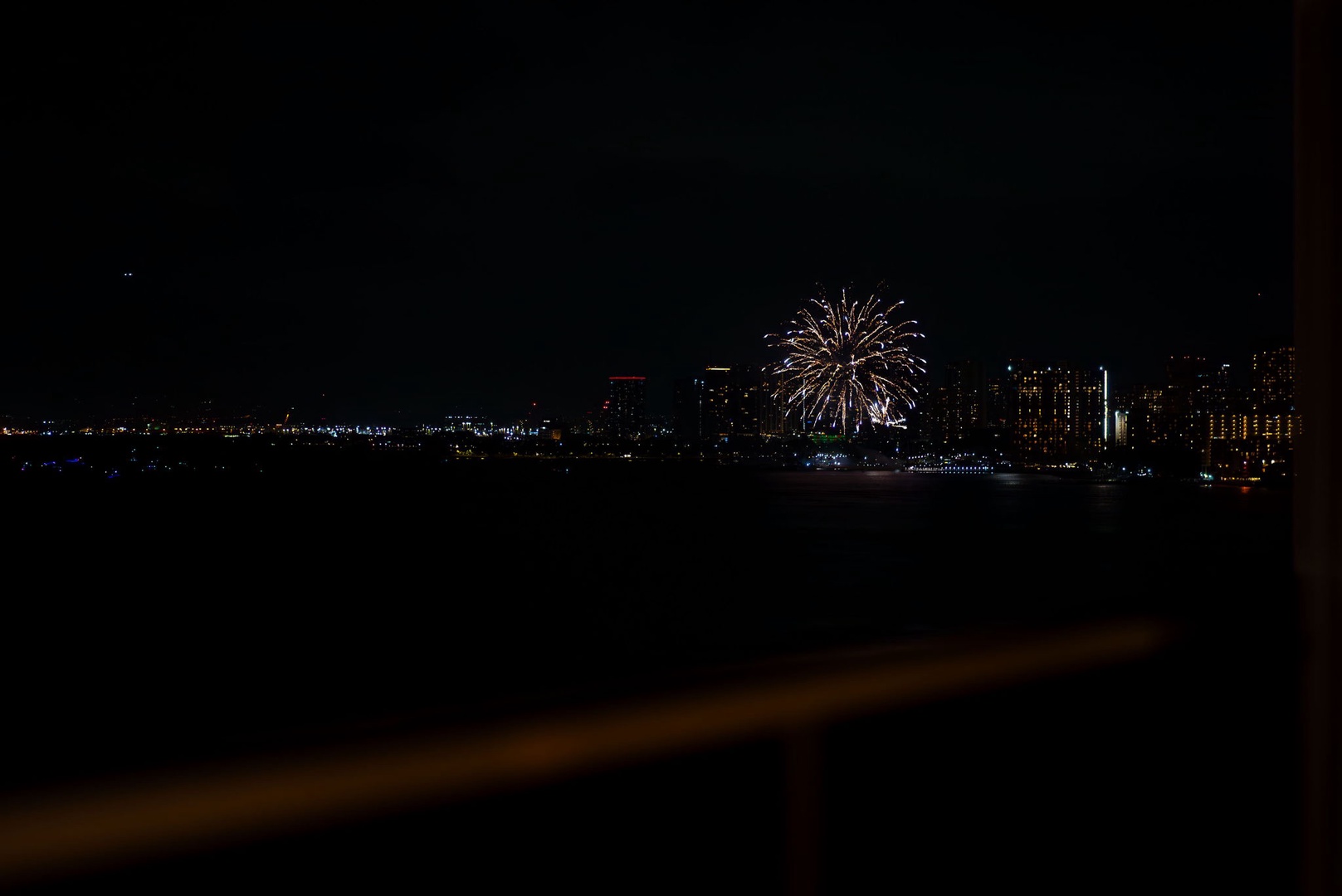 Honolulu Vacation Rentals, Hale Kaimana Breeze - Mesmerizing nighttime view with fireworks illuminating the skyline.