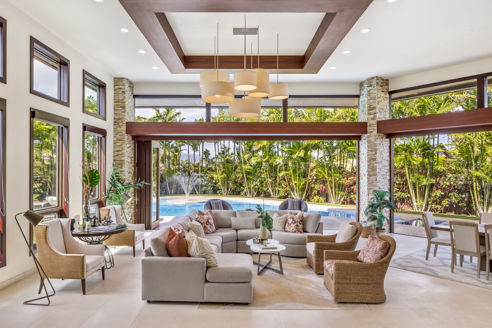 Honolulu Vacation Rentals, Kahala Grand Splendor - Spacious open-concept living and dining area seamlessly blending indoor and outdoor comfort.