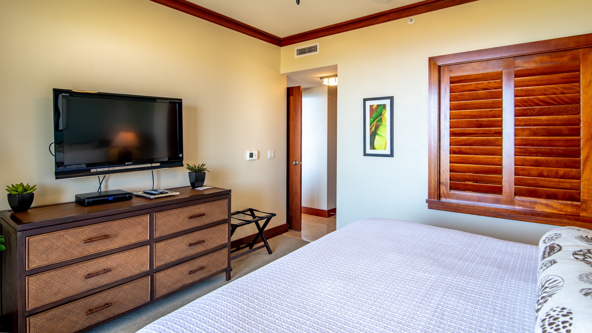 Kapolei Vacation Rentals, Ko Olina Beach Villas B901 - Vibrant framed art can be seen throughout the abode.