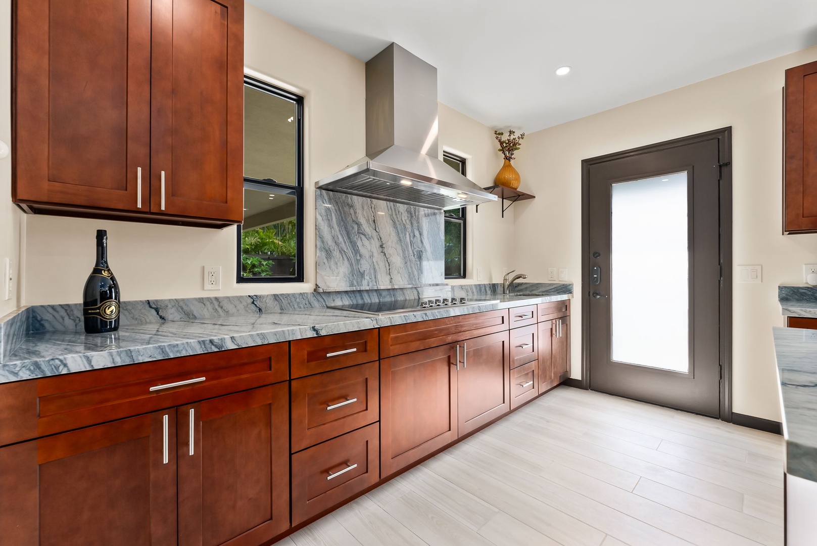 Honolulu Vacation Rentals, Kahala Zen - Spacious kitchen with custom cabinetry and a contemporary look.