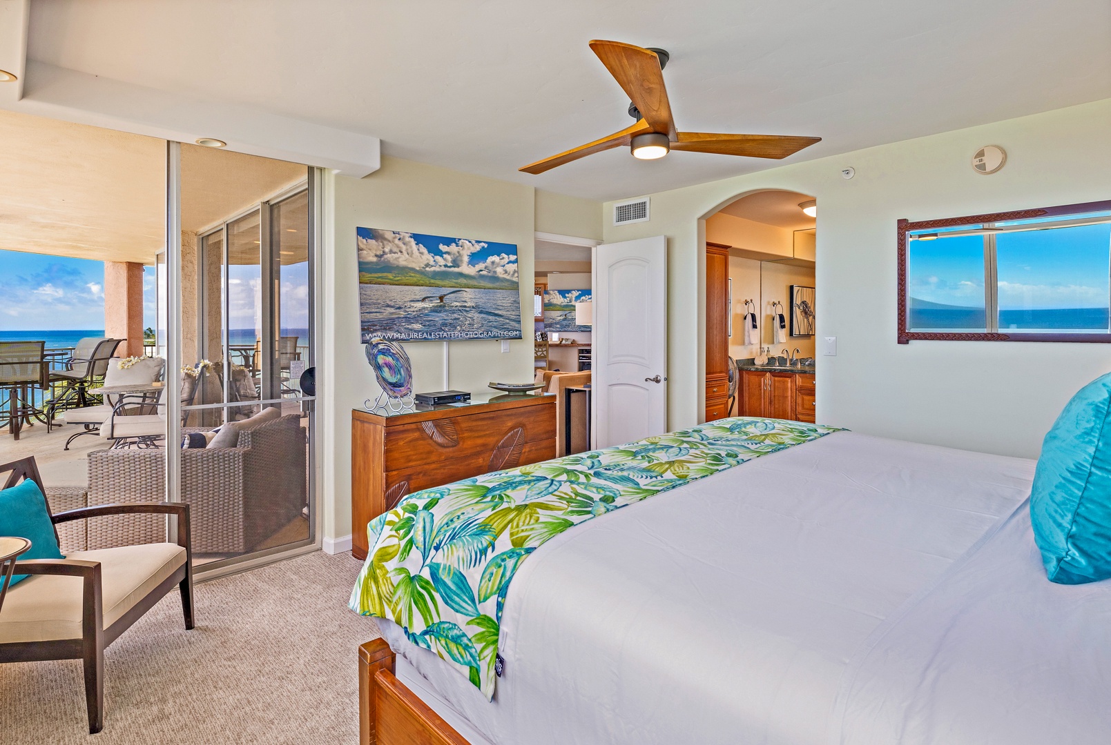 Lahaina Vacation Rentals, Royal Kahana 610 - The primary bedroom includes direct access to the lanai and a relaxing atmosphere with a tropical touch.