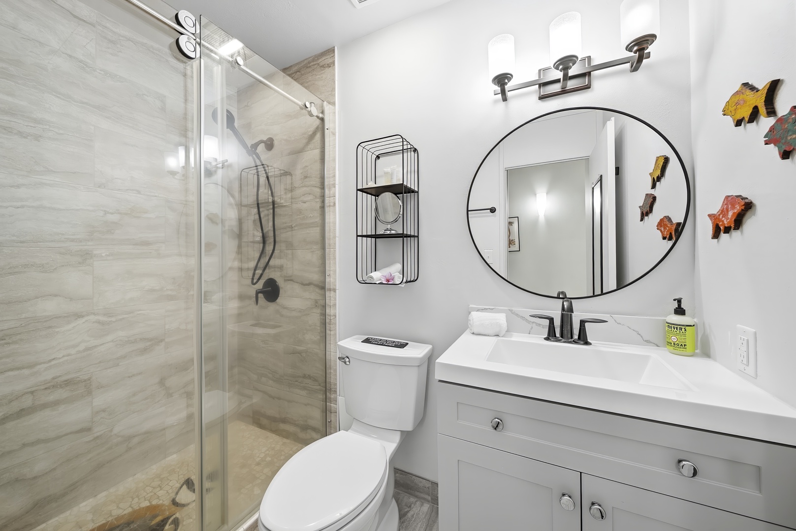 Kahuku Vacation Rentals, Kuilima Estates West #132 - Rinse off the salt in the glass walk-in shower, framed by a bright, tidy vanity.