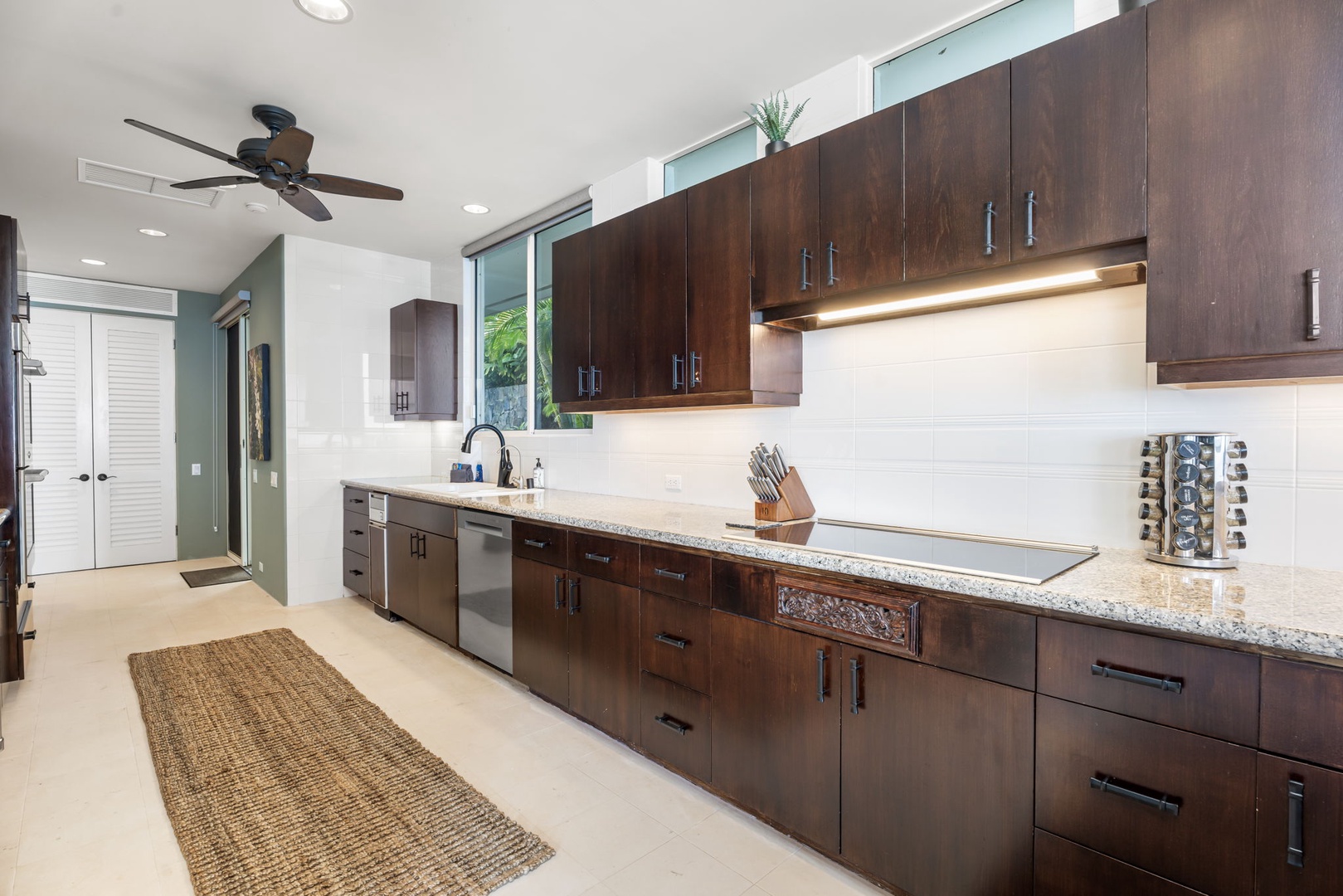 Kailua Kona Vacation Rentals, Hale Nai'a - Your gourmet kitchen features rich walnut cabinetry, granite counters, and stainless appliances perfect for creating memorable meals during your stay.