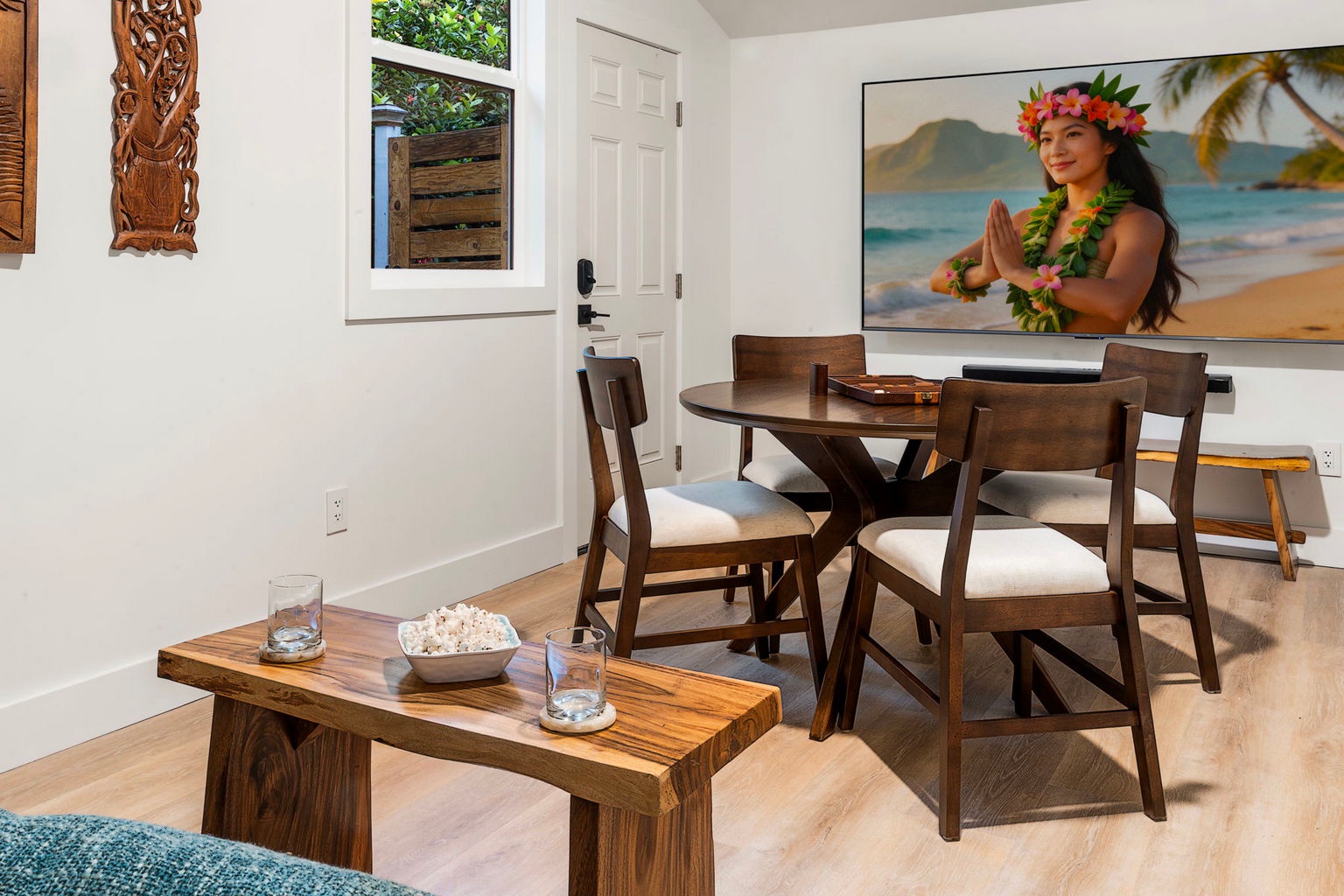 Kailua Kona Vacation Rentals, Manukai Hale - Island art and a wood table set the Boho tone in this second gathering space.