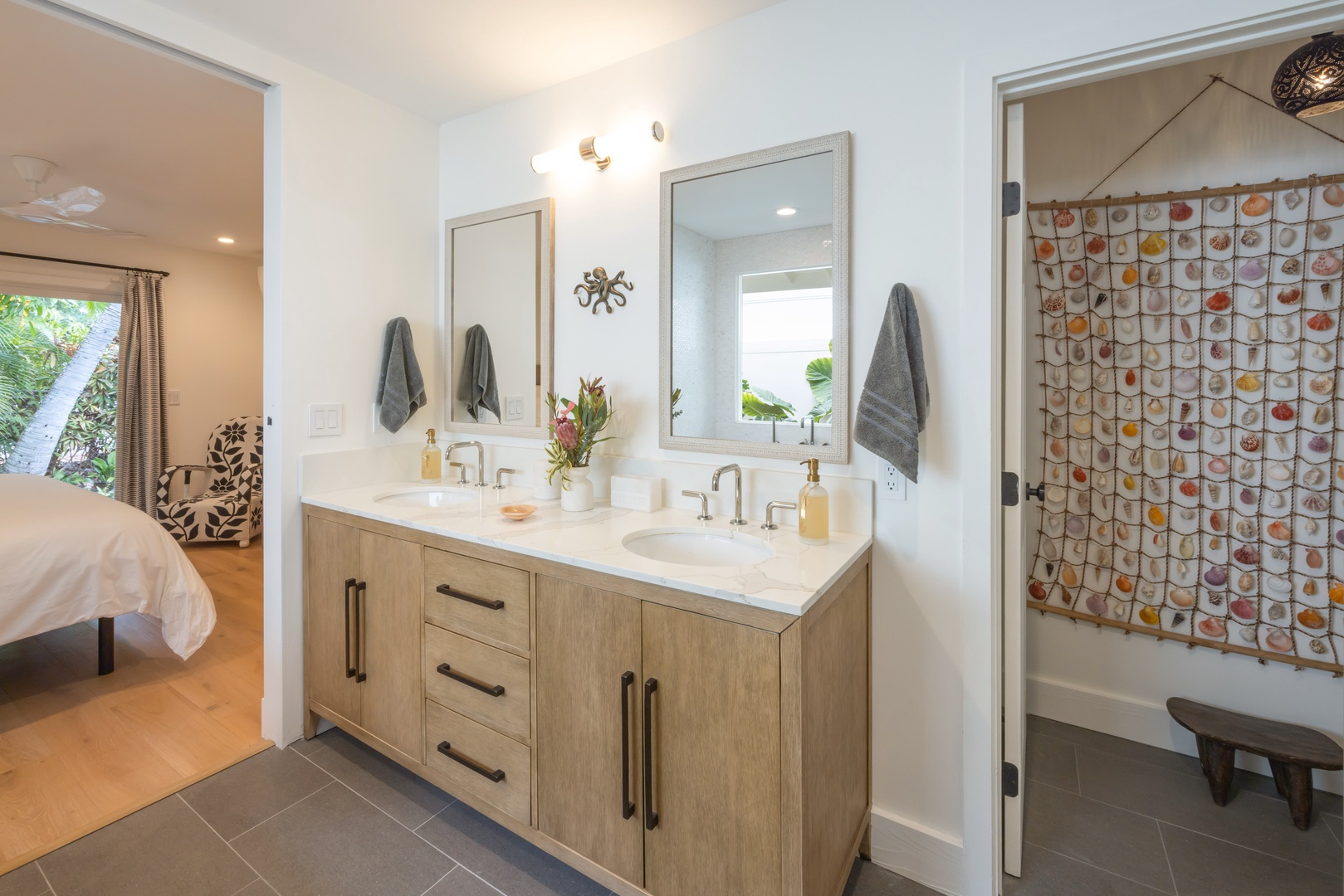 Kailua Vacation Rentals, Lanikai Ola Nani - Pamper yourself in the private bathroom, showcasing a dual sink setup, spacious walk-in closet, and a separate water closet.