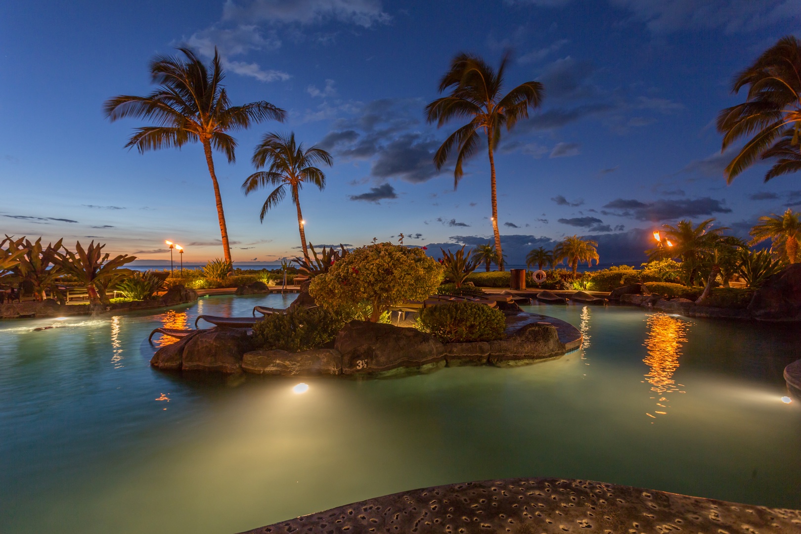 Waikoloa Vacation Rentals, 2BD Hali'i Kai (12C) at Waikoloa Resort - View of another portion of the pool at twilight.