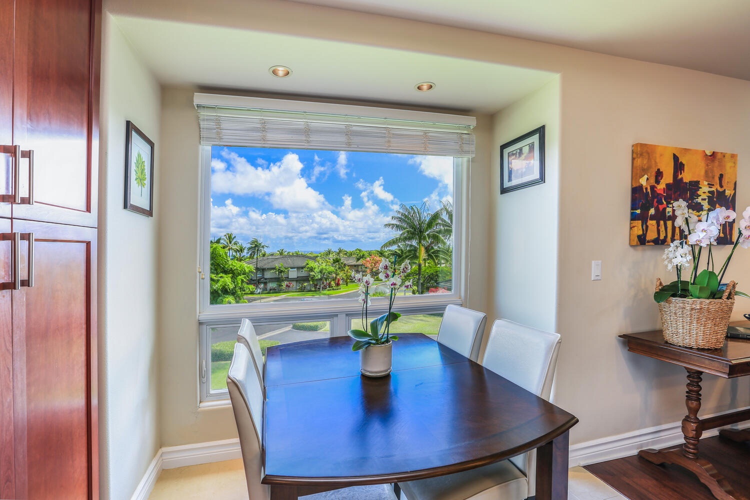 Princeville Vacation Rentals, Noelani Kai - Elegant dining space for savoring delightful meals with a view in a four seater dining table