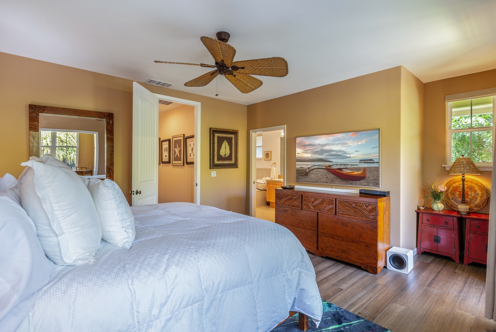 Princeville Vacation Rentals, Pualani Villa - The primary bedroom features a king-size bed, private lanai access, and plenty of natural light.