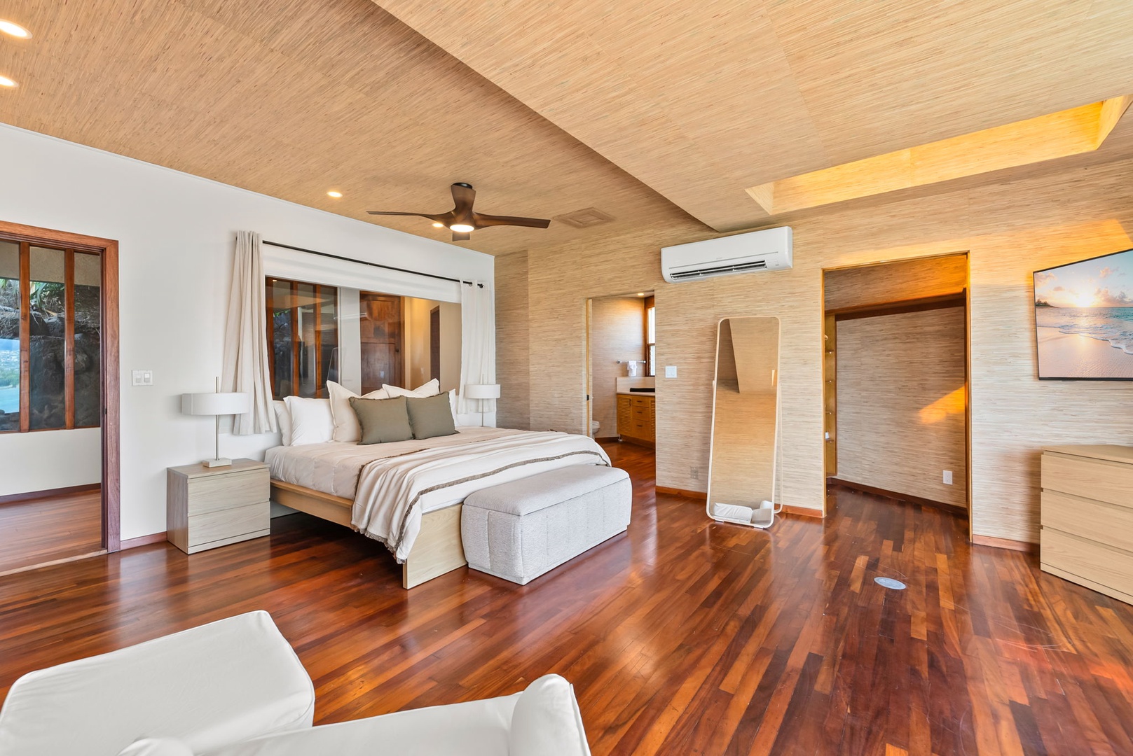 Honolulu Vacation Rentals, Black Point Ocean Villa - Unwind in your spacious suite featuring rich hardwood floors, bamboo ceiling details, and modern amenities for ultimate comfort.