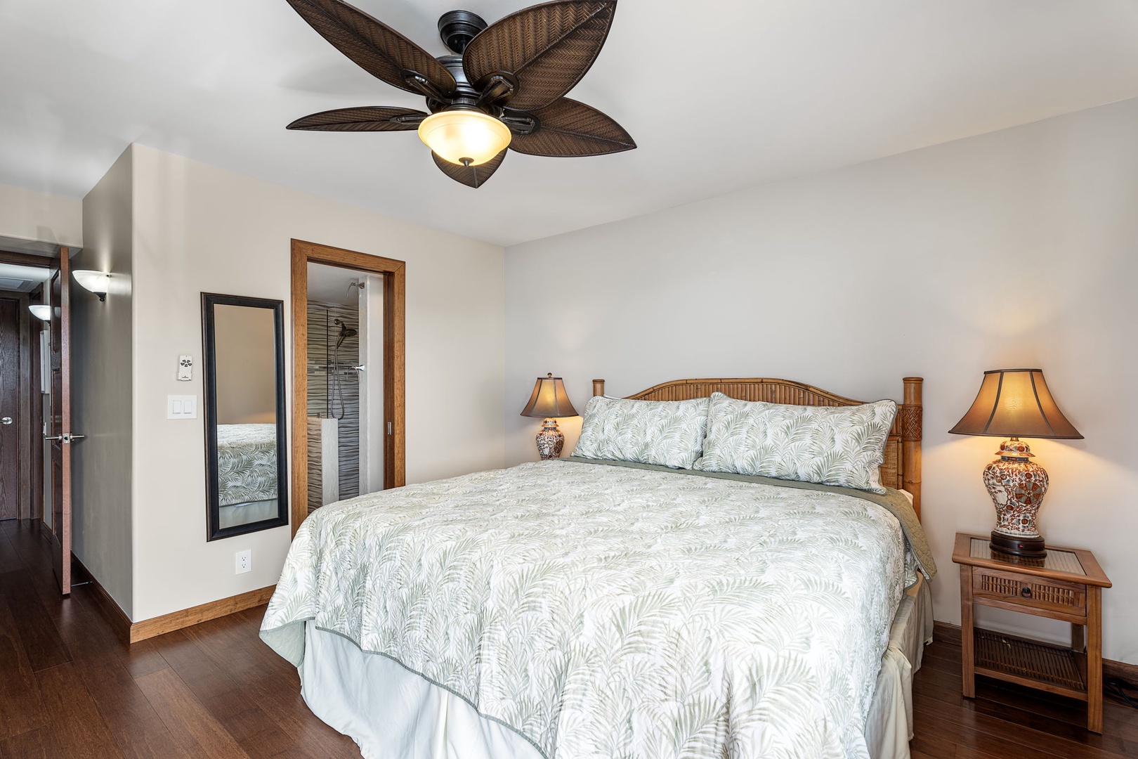 Kailua Kona Vacation Rentals, Royal Kahili 401A - Primary bedroom with a king-sized bed, warm lighting, and tasteful decor.