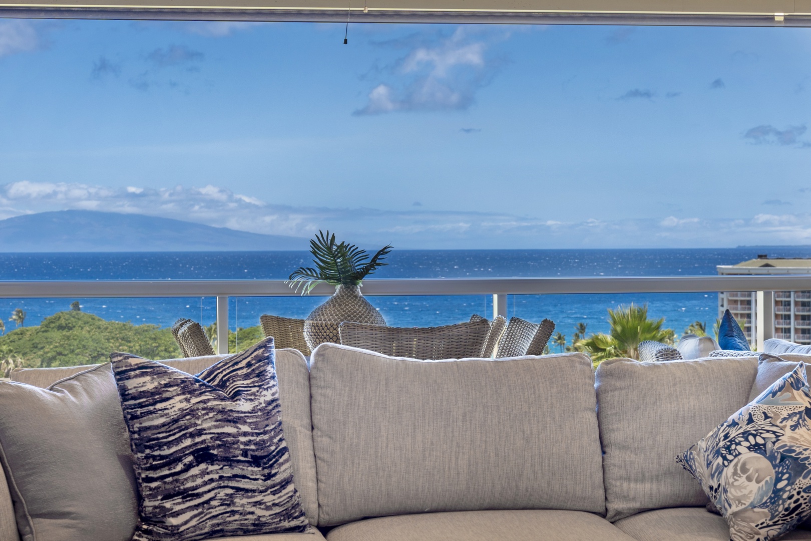 Wailea Vacation Rentals, Wailea Luxury Residence Hoolei 23-3 - Relax on the plush sofa while soaking in uninterrupted views of the ocean, creating a seamless connection between indoor comfort and outdoor serenity.