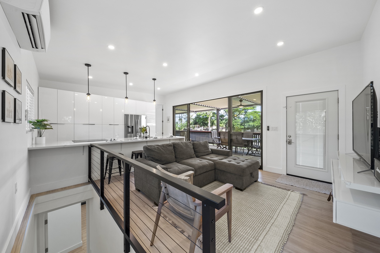 Haleiwa Vacation Rentals, Sunset Beach Island Retreat - The open-concept living room seamlessly flows into the kitchen, creating an inviting space for socializing and relaxation