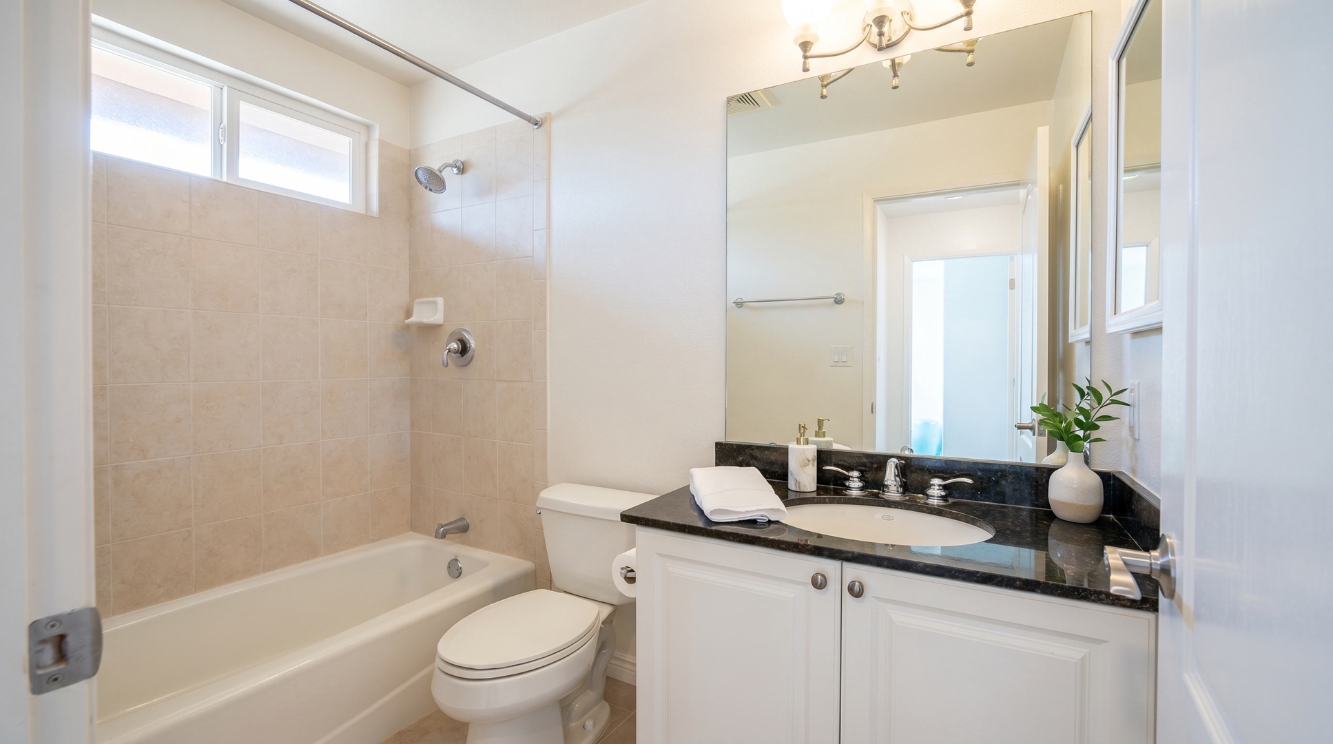 Shared full bath with a tub-shower keeps mornings moving when the whole group is up.