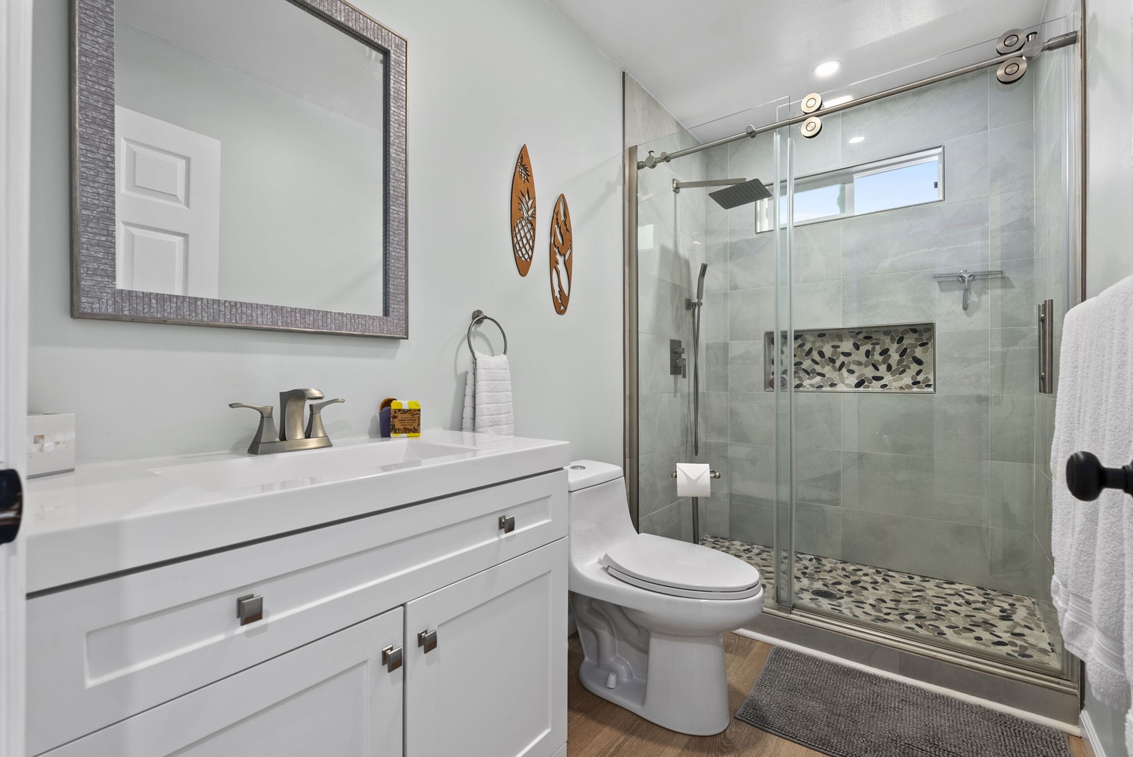 Kailua Vacation Rentals, Hale Alapi'i Lanikai Getaway - Freshen up in this stylish bathroom, featuring a sleek vanity and a walk-in shower.