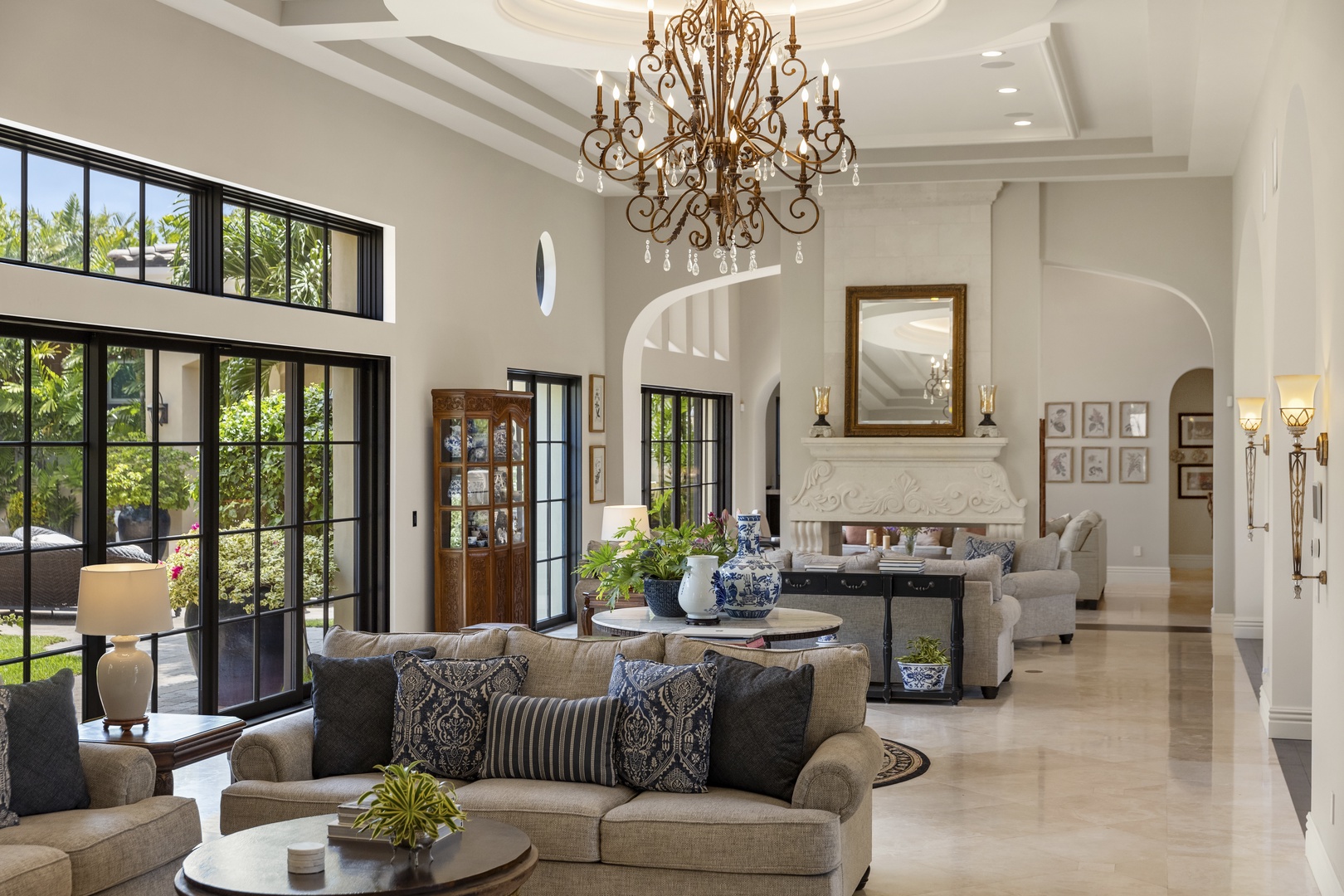 Honolulu Vacation Rentals, The Kahala Mansion Event Venue - Spacious living area with high ceilings, natural light, and luxurious furnishings for a warm and inviting atmosphere.