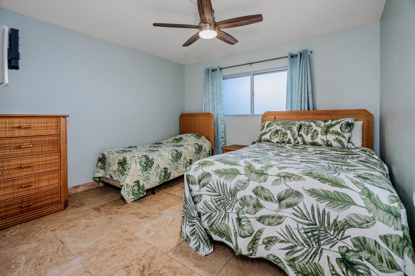 Kihei Vacation Rentals, Menehune Shores 420 - Green palm-print bedding and two beds make the second bedroom its own quiet corner.