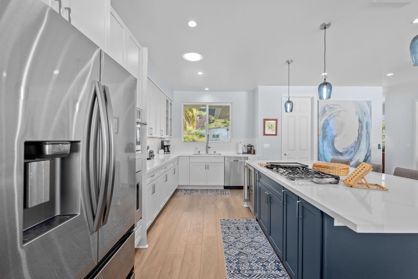 Waianae Vacation Rentals, Oceanfront Luxury Dream Estate - Main-level kitchen and dining area with sleek lines and open-concept layout.