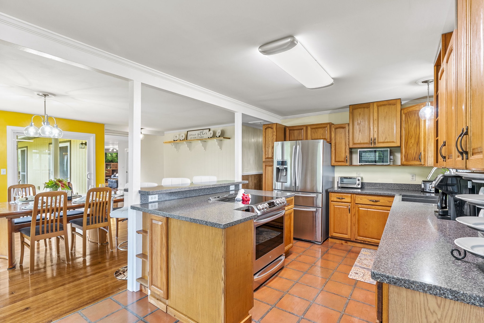 Hauula Vacation Rentals, Mau Loa Hale - Kitchen opens to the dining area