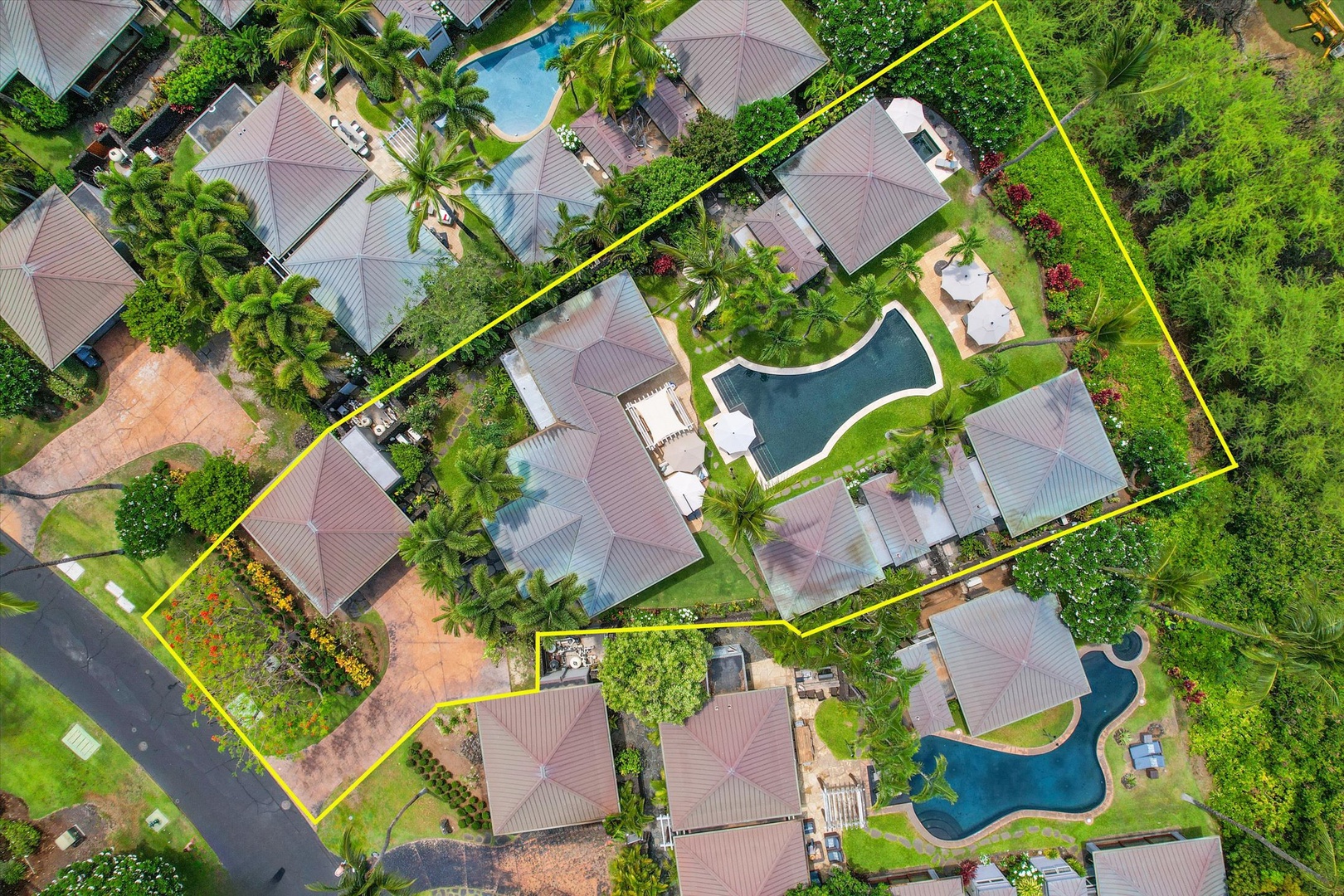 Kamuela Vacation Rentals, 3BD Na Hale 3 at Pauoa Beach Club at Mauna Lani Resort - Seen from the air, the community threads pools and garden paths between low rooftops.